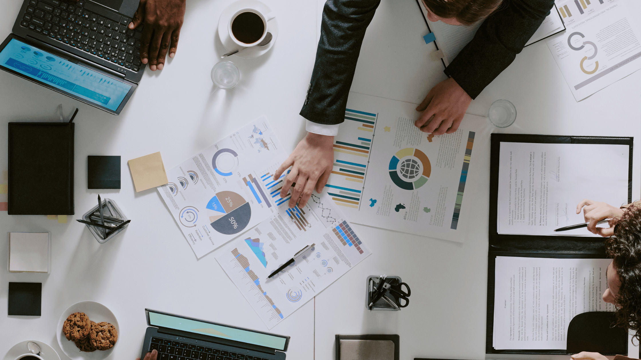 Team meeting at table to discuss marketing reset for business